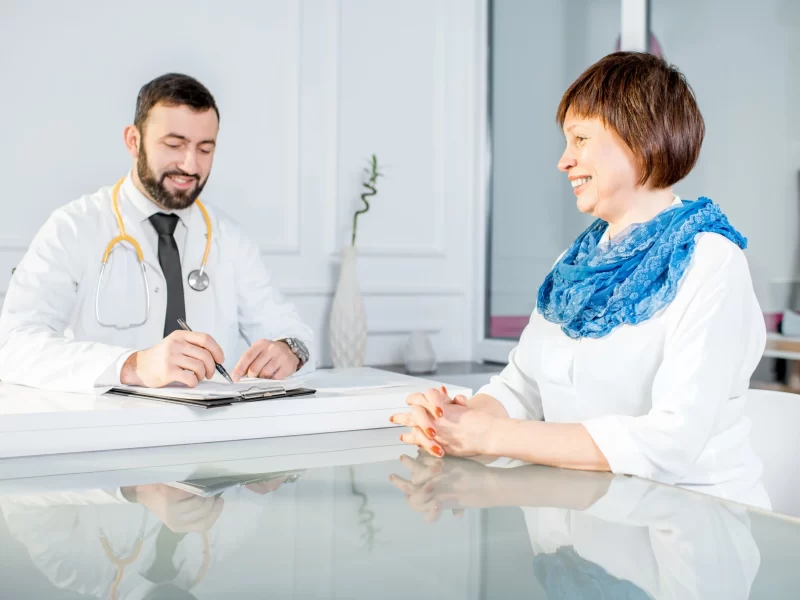 older-woman-with-doctor-at-the-office-2023-11-27-05-11-42-utc